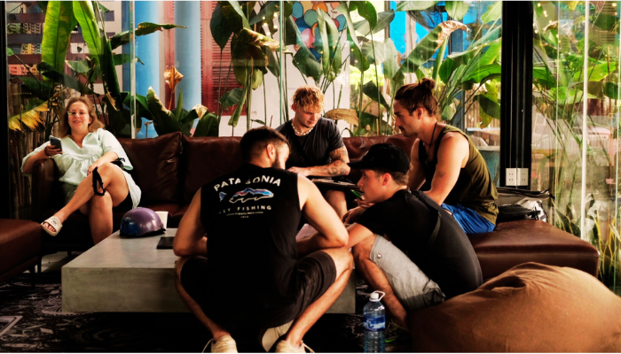 A group of friends waiting to get a tattoo at The Hangout Tattoo studio in Hoi An