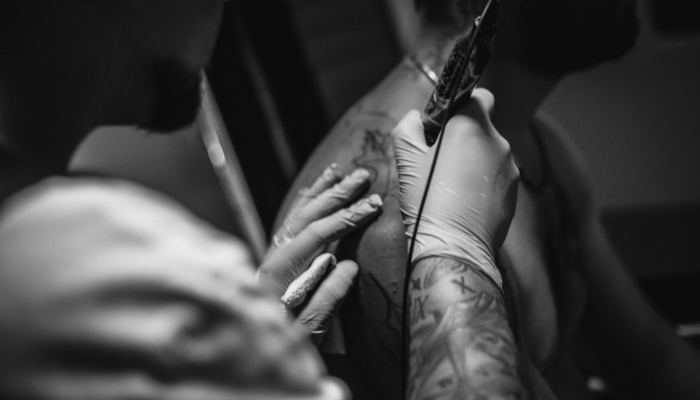 Close up of a shoulder tattoo being done