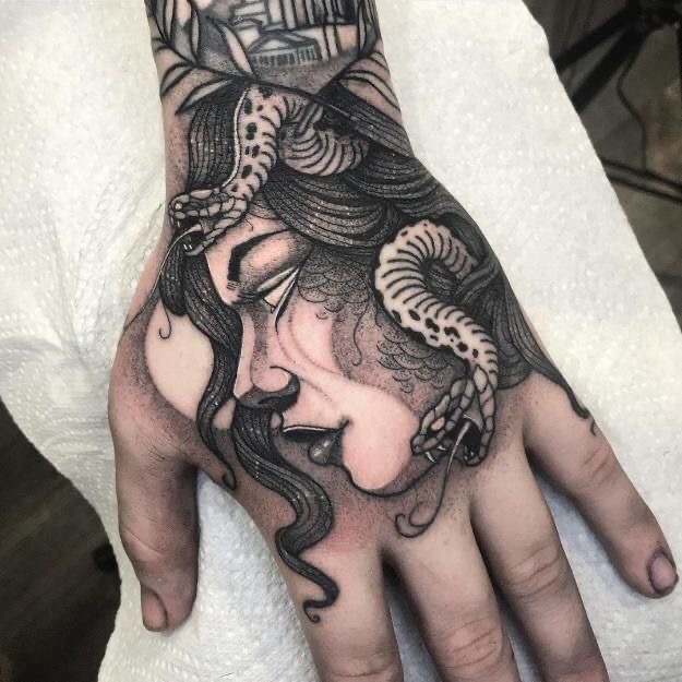 What does a Medusa hand tattoo mean for a girl?
