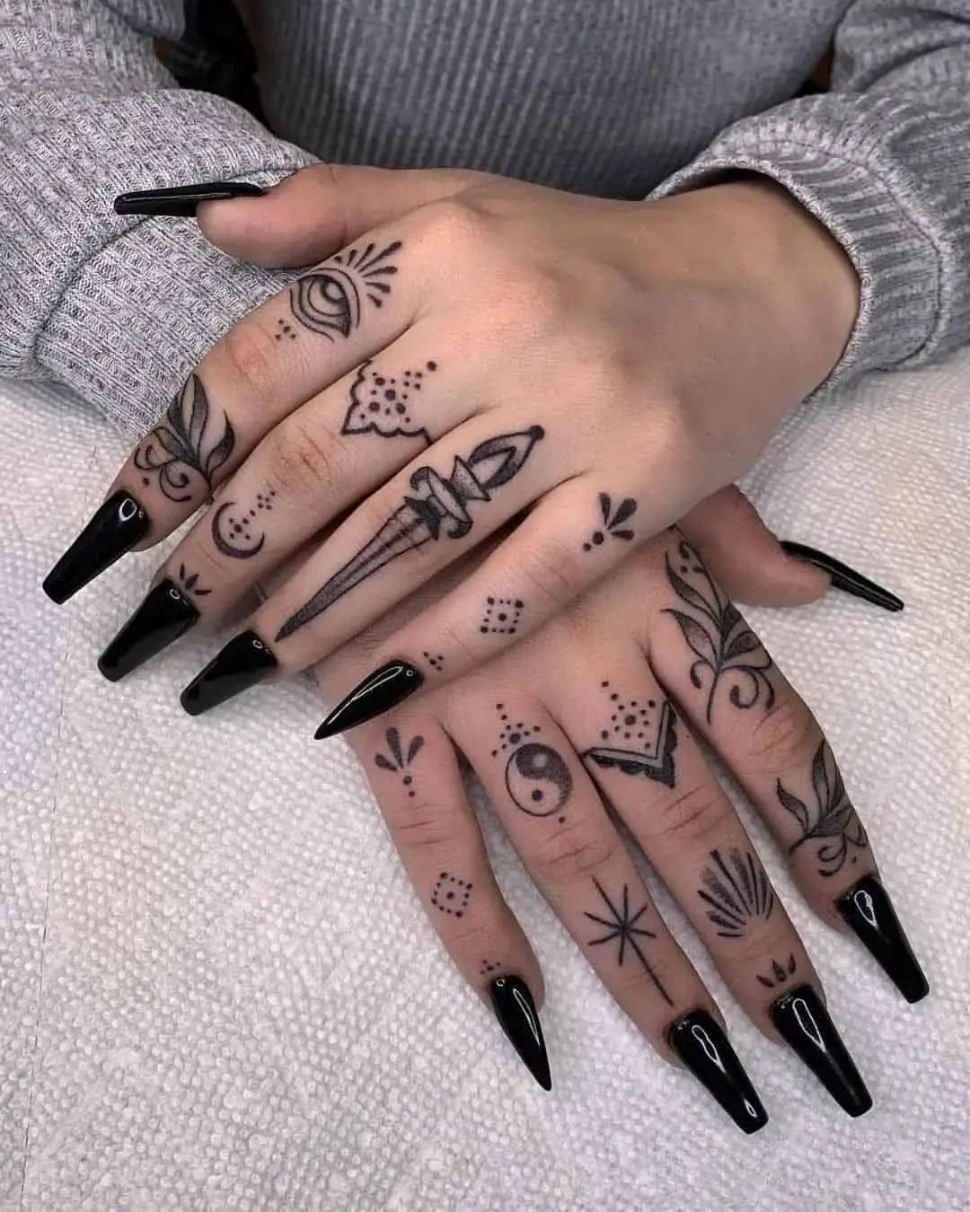 Hand and finger tattoos